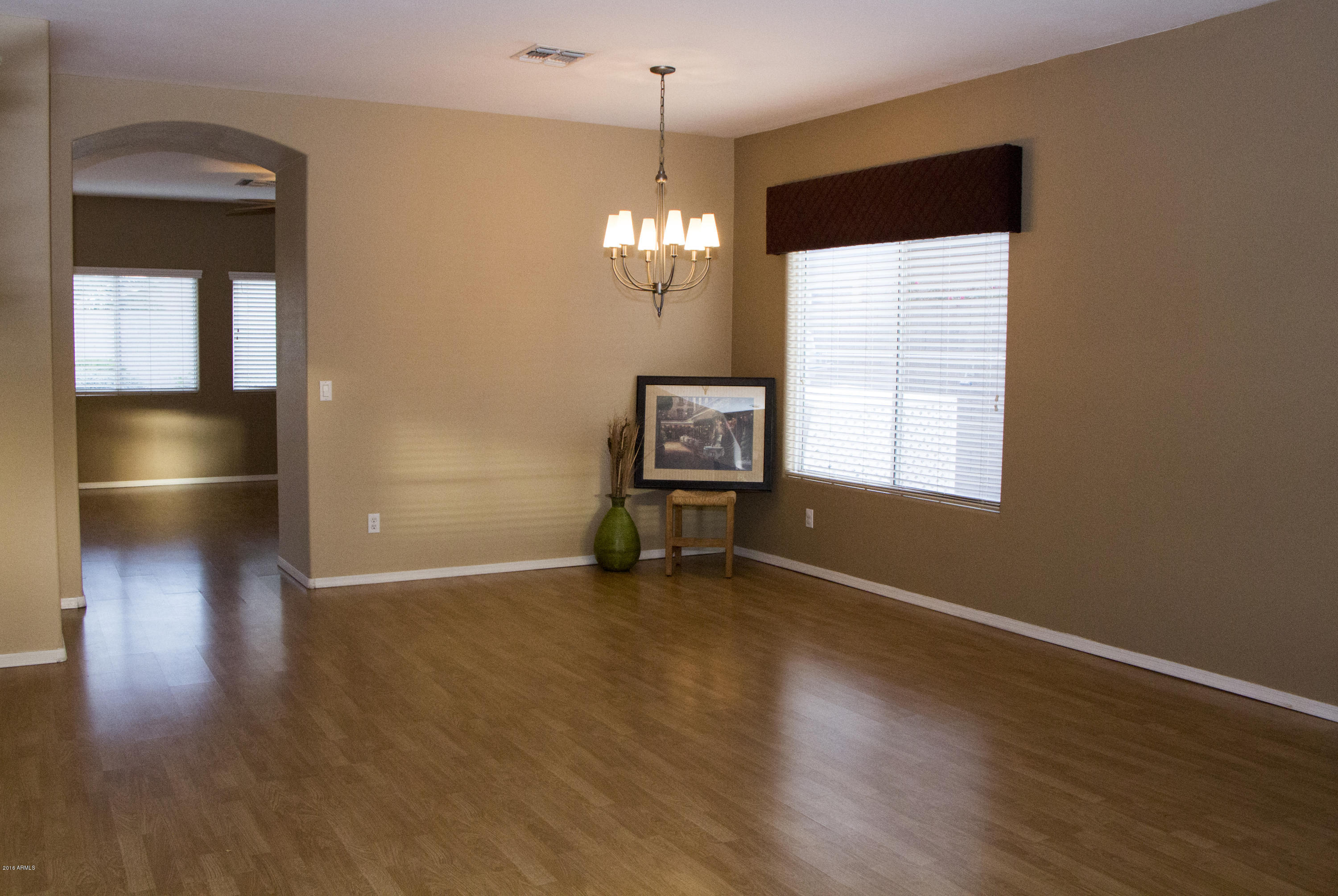 3517 South Sawmill Road Gilbert, AZ 85297 - Photo 8 of 26 a view of an empty room with window and wooden floor