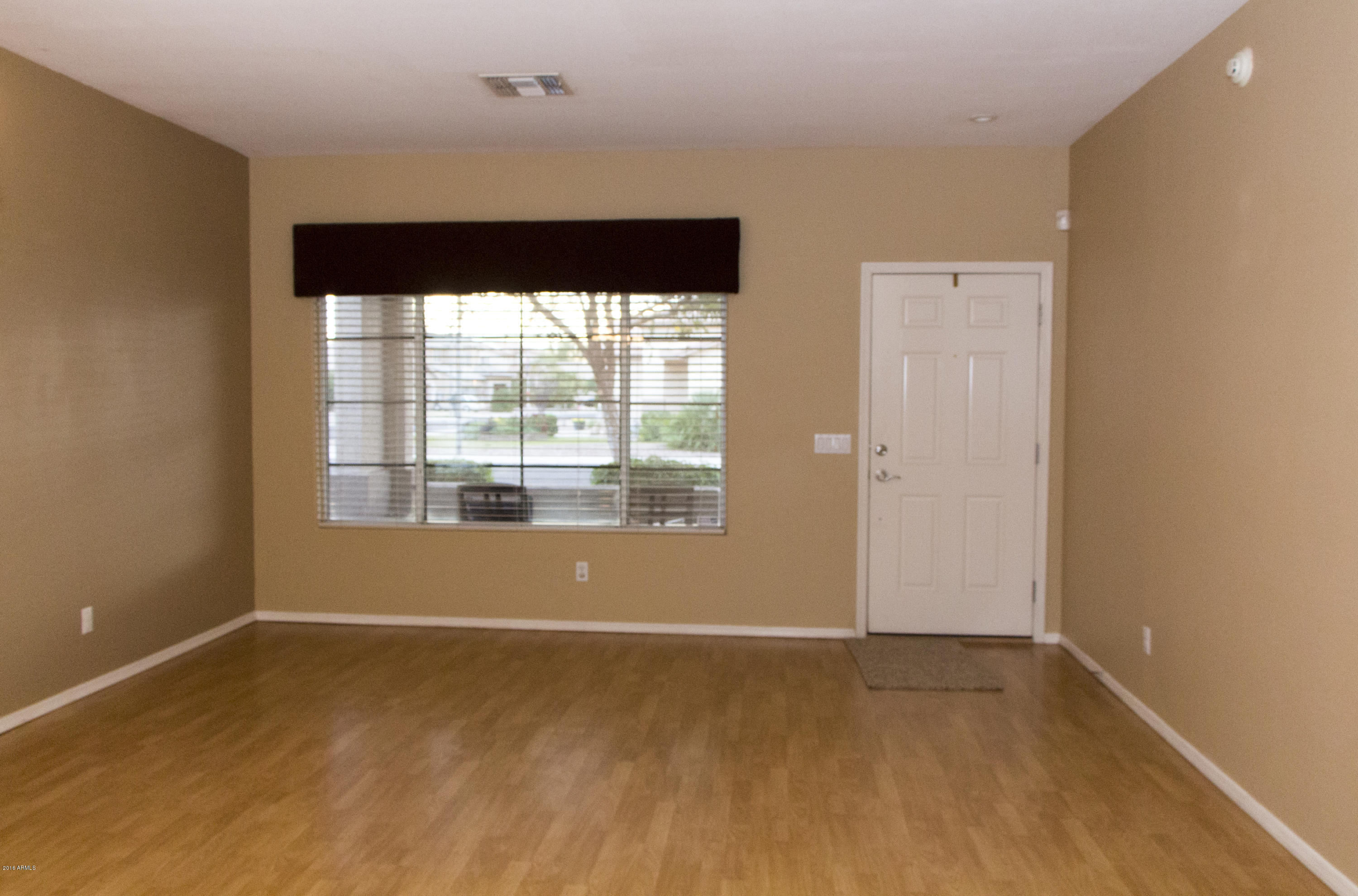 3517 South Sawmill Road Gilbert, AZ 85297 - Photo 9 of 26 a big room with wooden floor