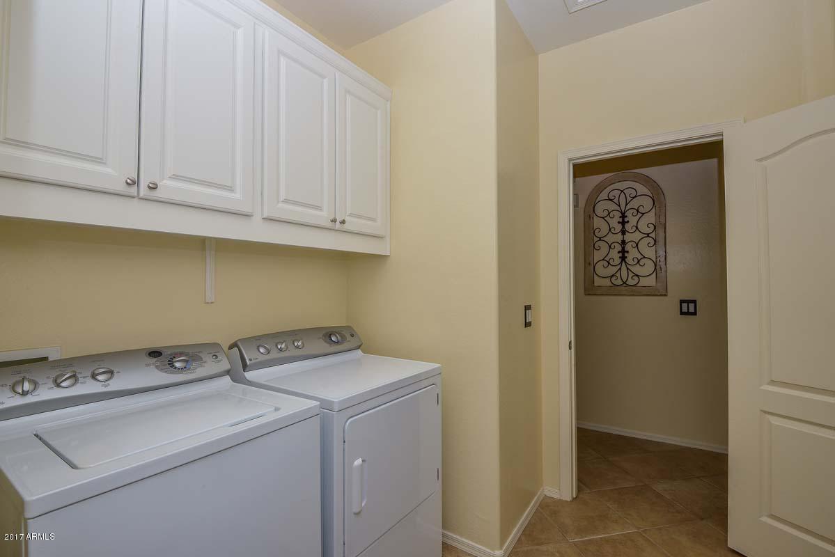 6825 West Carson Road Laveen, AZ 85339 - Photo 17 of 18 Laundry Room w/ Cabinets