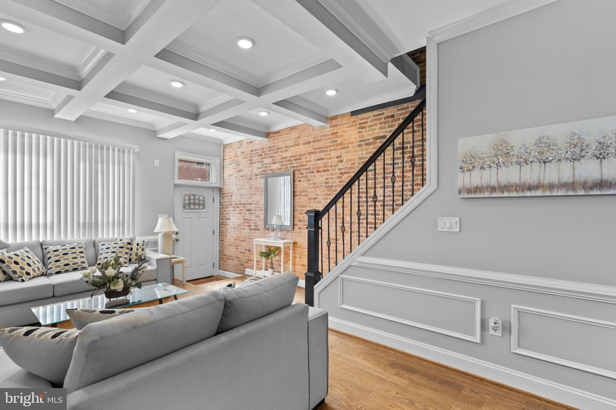 1330 Aisquith Street Baltimore, MD 21202 - Photo 16 of 47 a living room with furniture and wooden floor