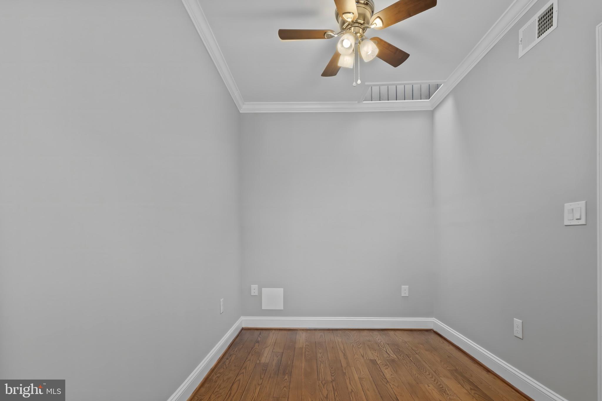 1330 Aisquith Street Baltimore, MD 21202 - Photo 28 of 47 a view of room with window and wooden floor