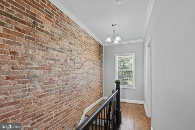 a view of a hallway with windows