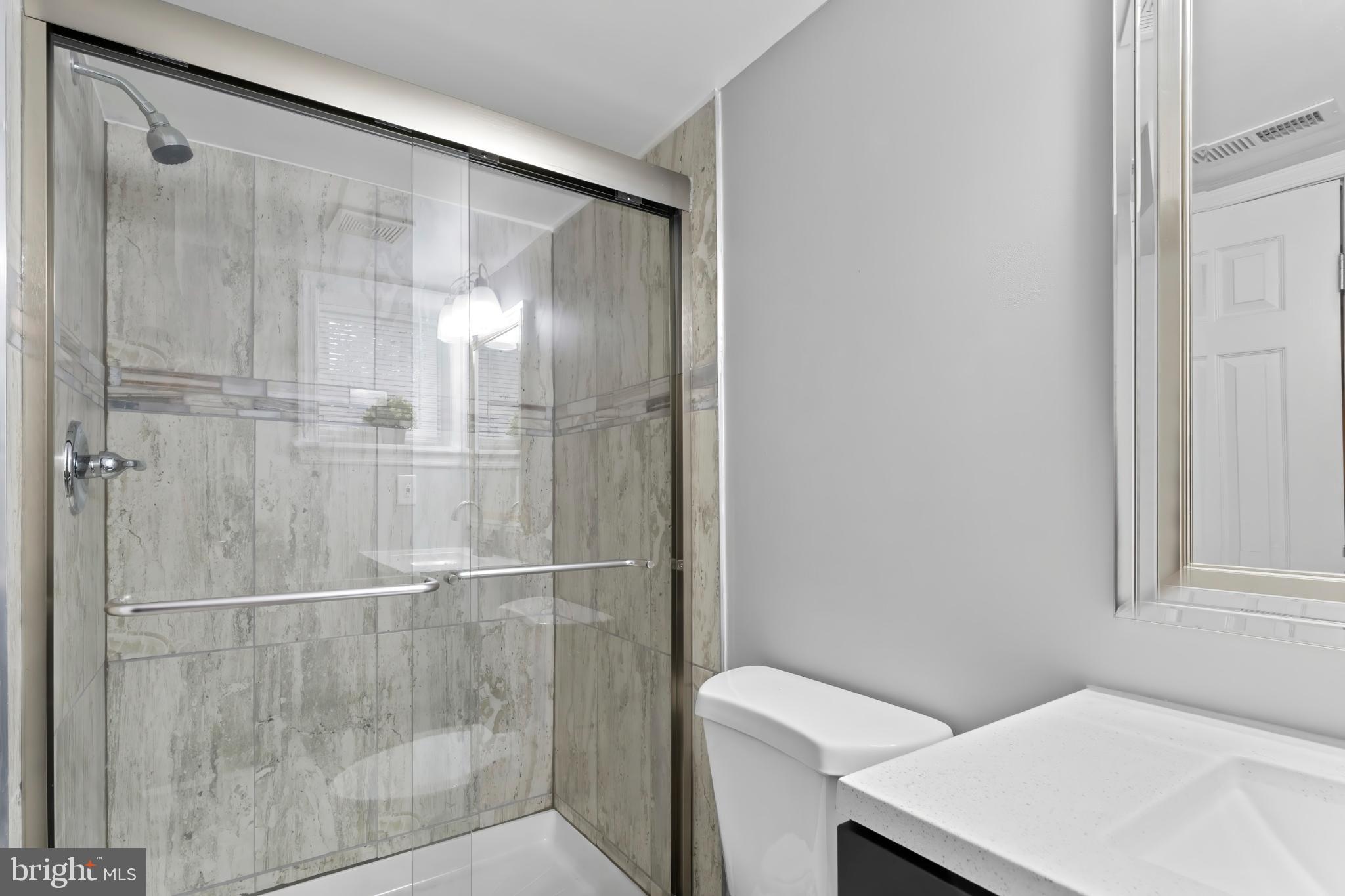 1330 Aisquith Street Baltimore, MD 21202 - Photo 36 of 47 a bathroom with a shower and a sink