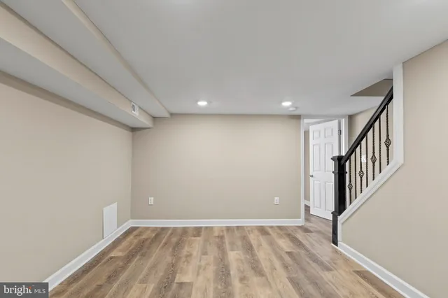 a view of an empty room with stairs