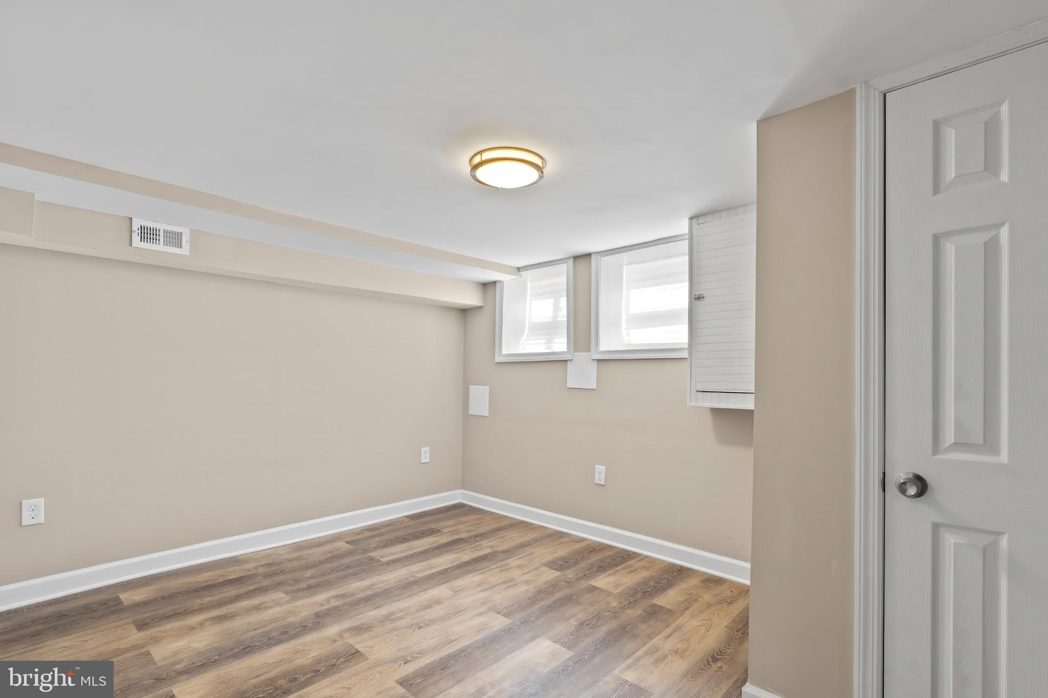 1330 Aisquith Street Baltimore, MD 21202 - Photo 39 of 47 a view of an empty room with a window