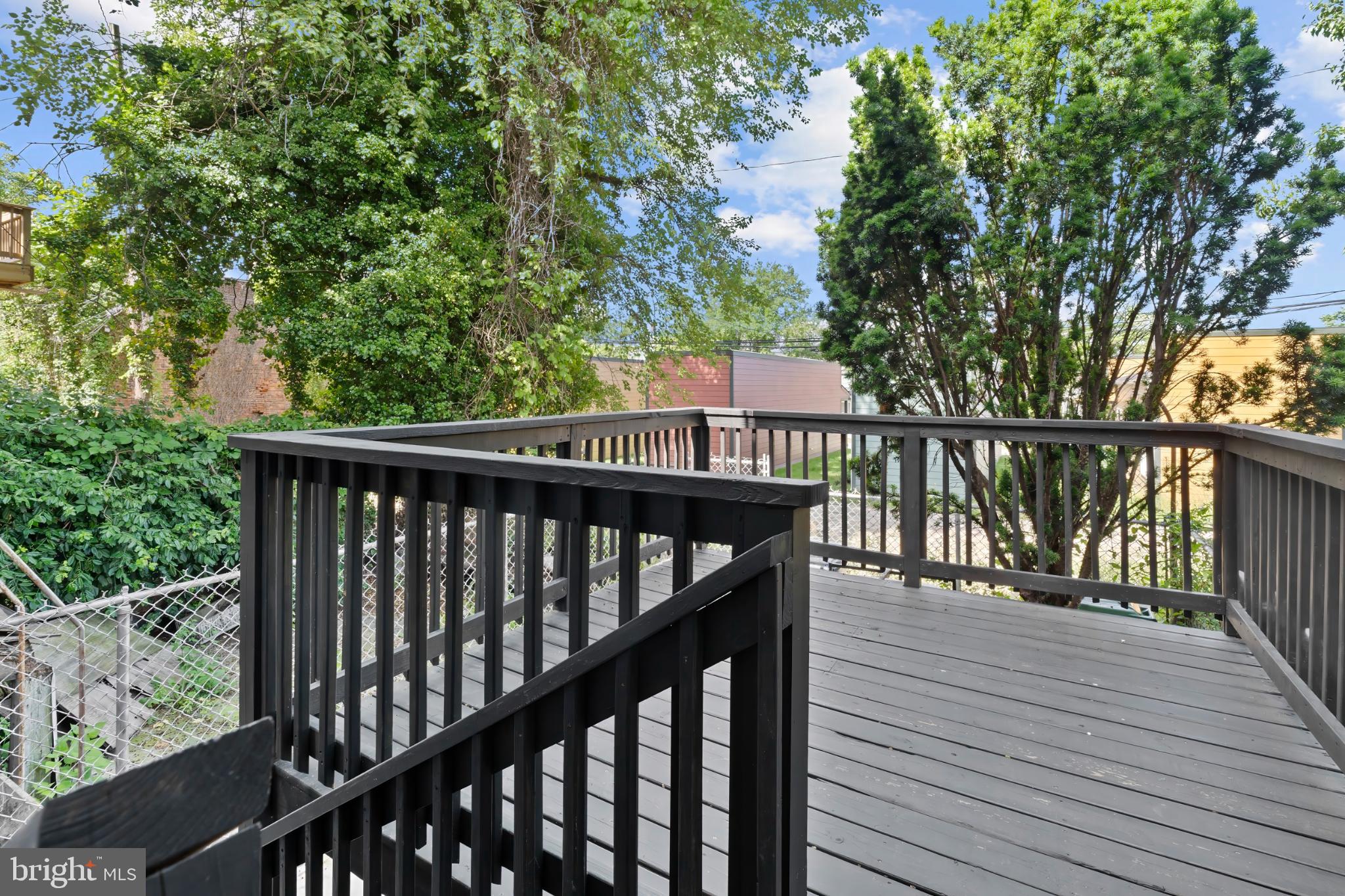 1330 Aisquith Street Baltimore, MD 21202 - Photo 43 of 47 a view of balcony with wooden floor and fence