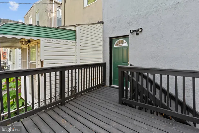 a view of a wooden balcony with wooden floor
