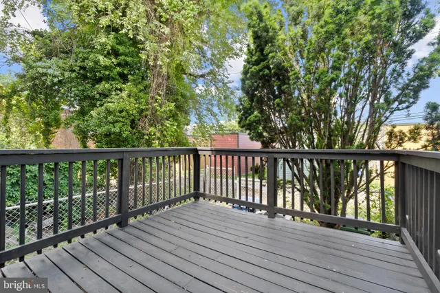 a view of balcony with wooden floor