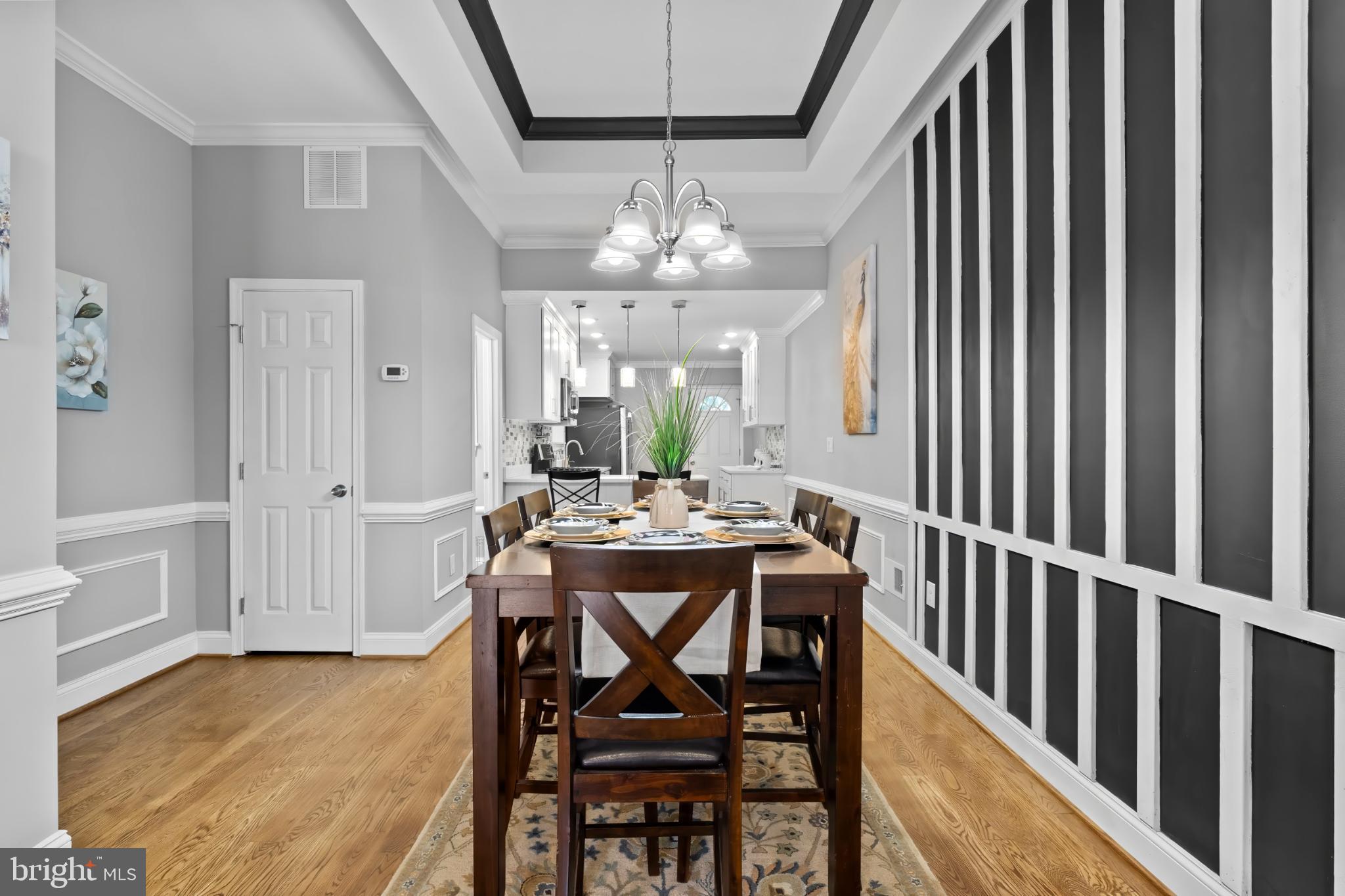 1330 Aisquith Street Baltimore, MD 21202 - Photo 7 of 47 a view of a dining room with furniture window and wooden floor