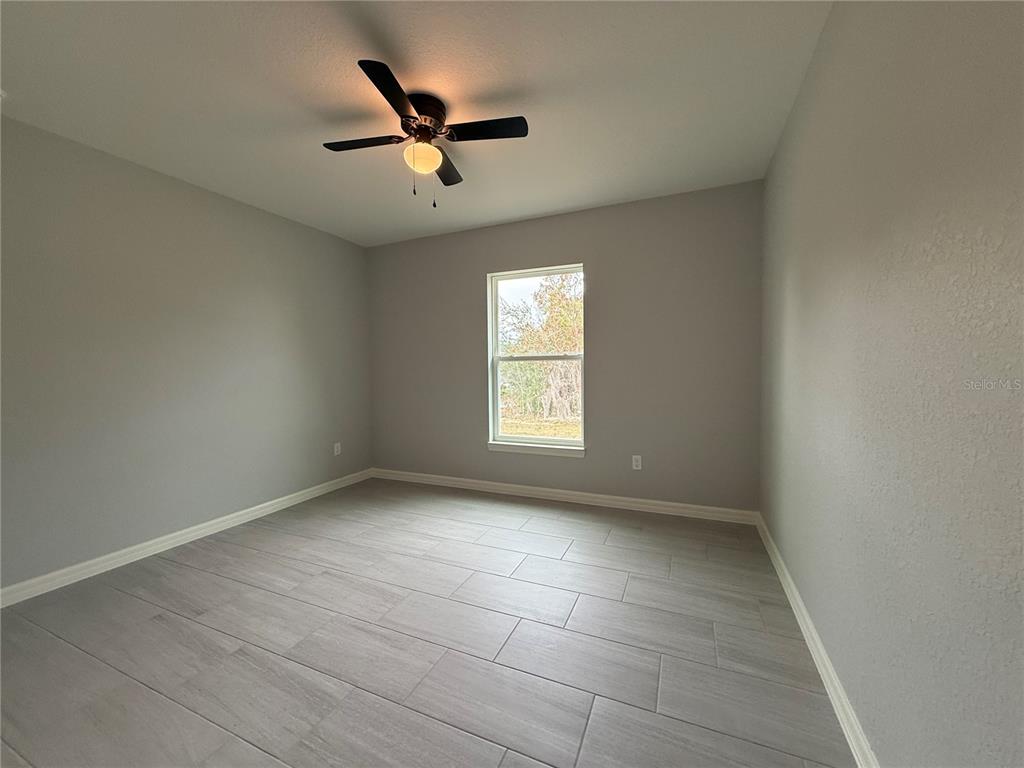 20500 Southwest 54th Street Dunnellon, FL 34431 - Photo 19 of 27 an empty room with a window