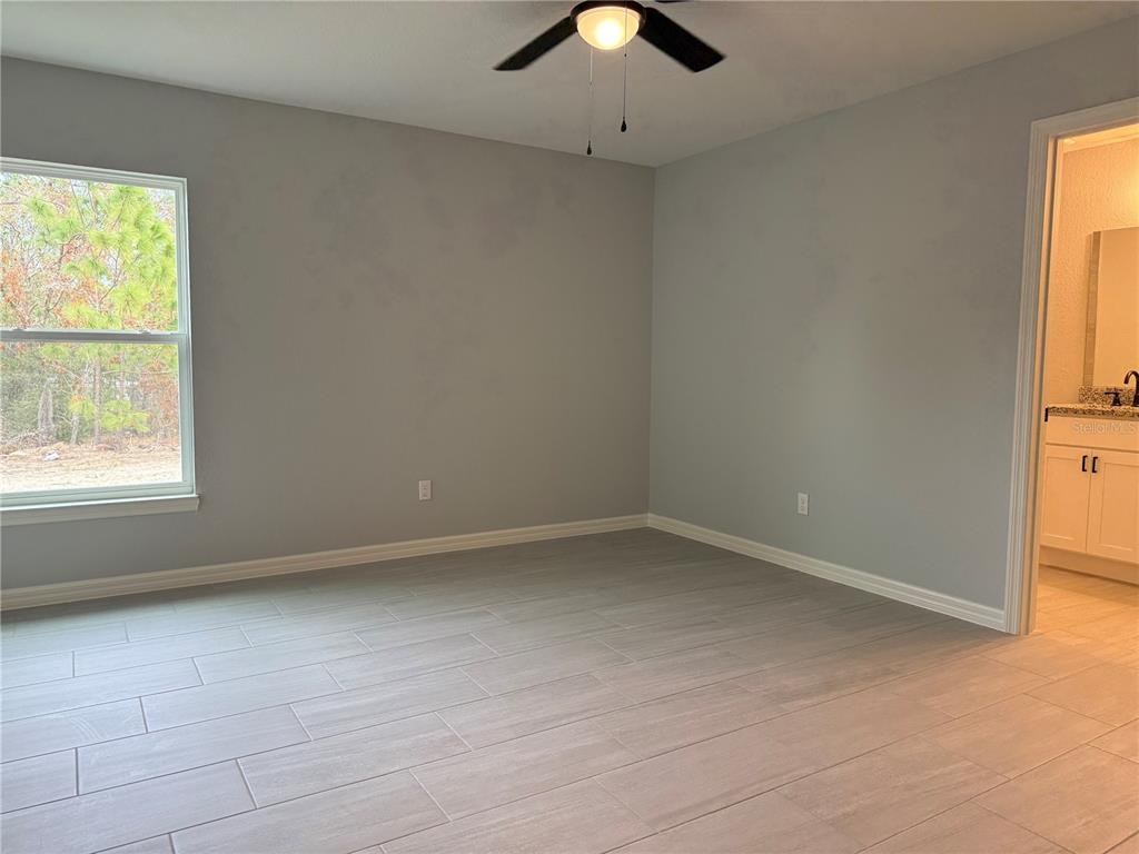 20500 Southwest 54th Street Dunnellon, FL 34431 - Photo 22 of 27 an empty room with a window