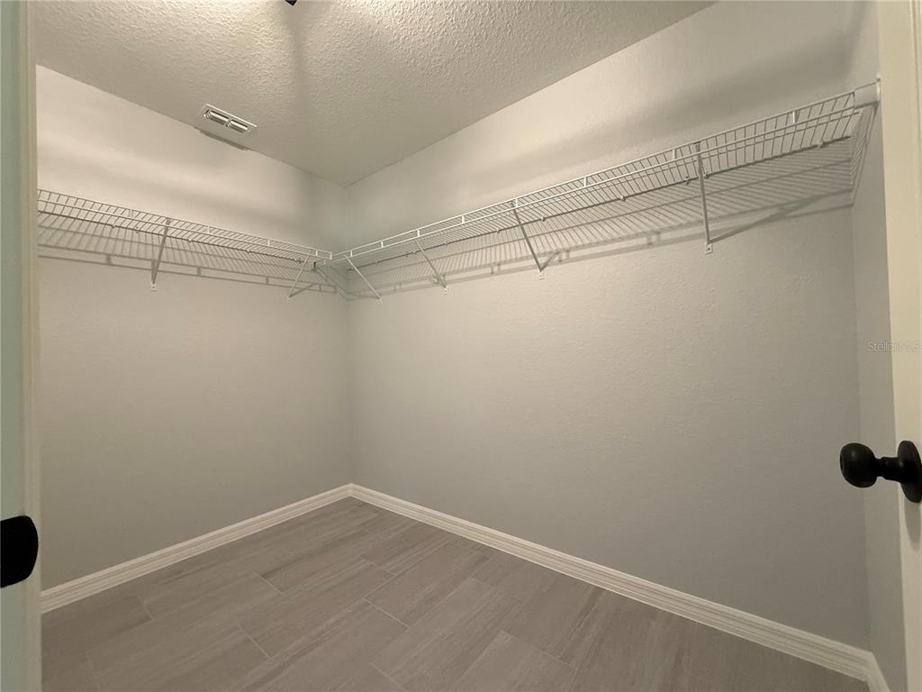 20500 Southwest 54th Street Dunnellon, FL 34431 - Photo 10 of 27 a view of a room with racks on the wall