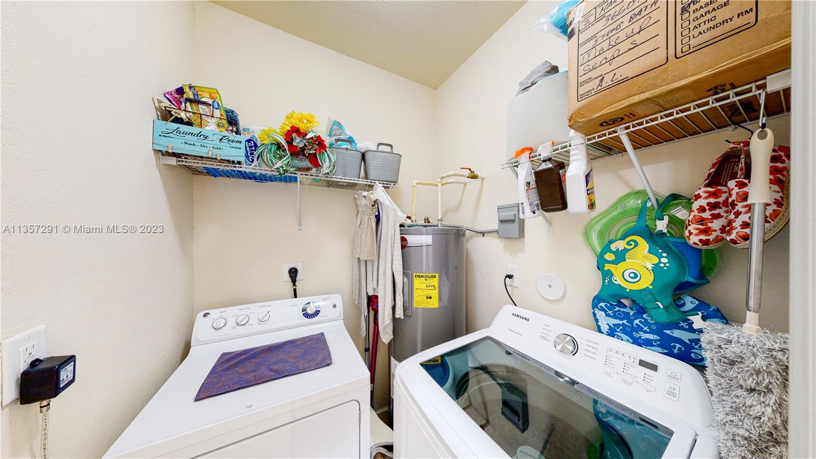672 Southeast 34th Avenue Homestead, FL 33033 - Photo 11 of 65 a utility room with dryer and washer