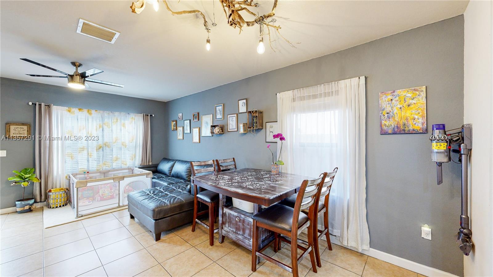 672 Southeast 34th Avenue Homestead, FL 33033 - Photo 20 of 65 a dining room with furniture and window
