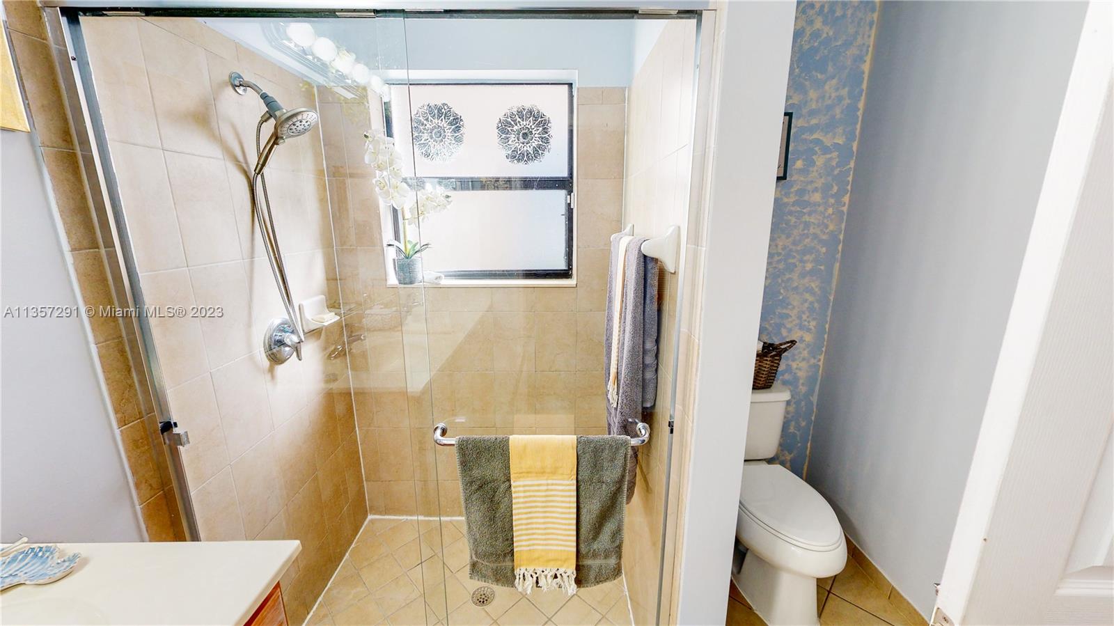672 Southeast 34th Avenue Homestead, FL 33033 - Photo 28 of 65 a bathroom with a sink toilet and shower