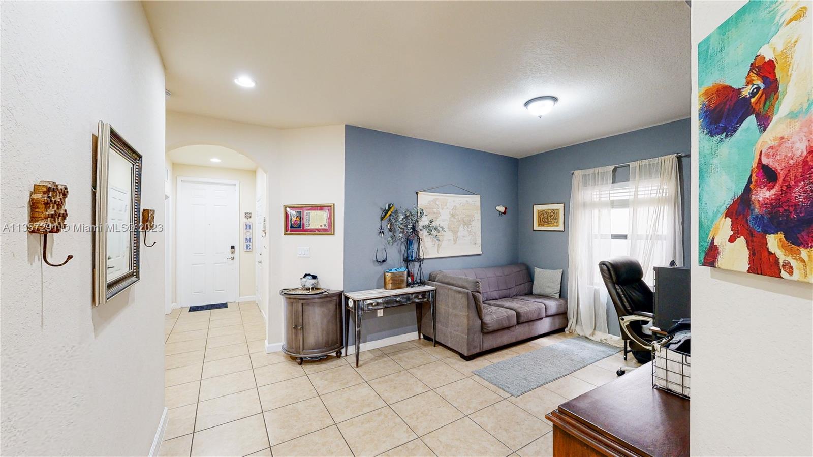 672 Southeast 34th Avenue Homestead, FL 33033 - Photo 3 of 65 a living room with furniture