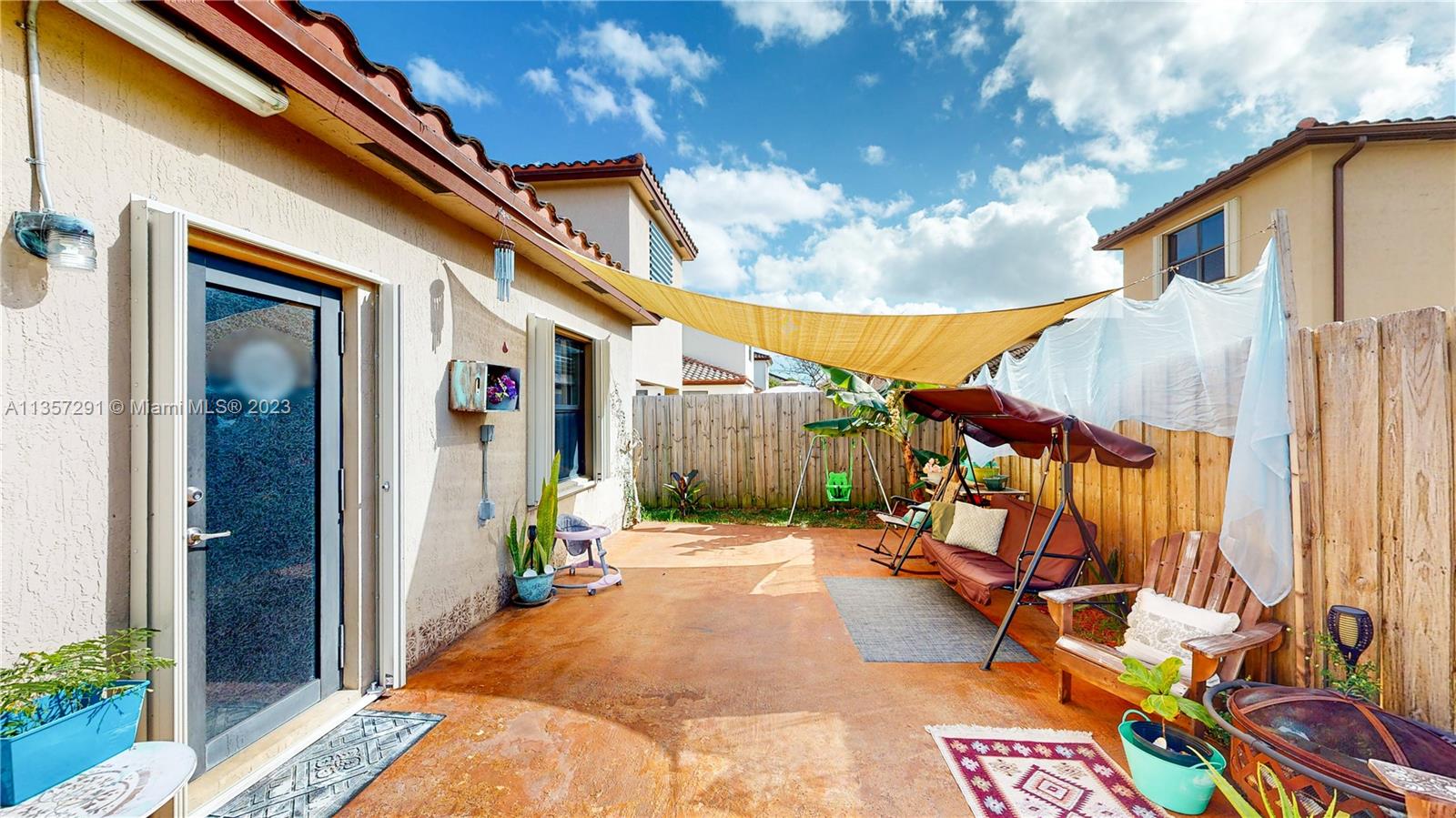 672 Southeast 34th Avenue Homestead, FL 33033 - Photo 35 of 65 a backyard of a house with seating space