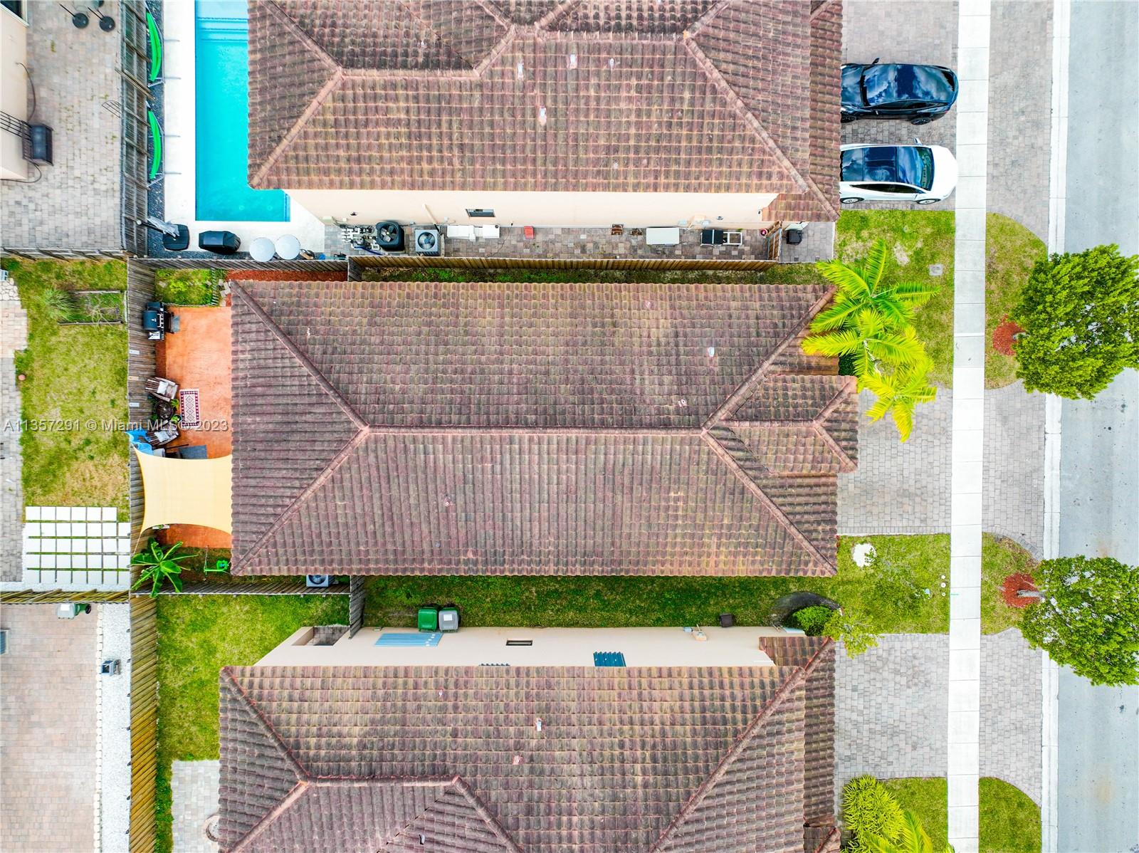 672 Southeast 34th Avenue Homestead, FL 33033 - Photo 49 of 65 a aerial view of a house with a yard and potted plants