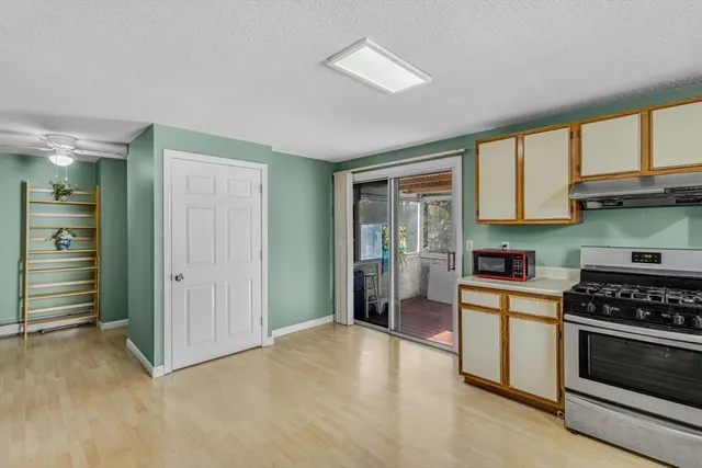 a kitchen with stainless steel appliances granite countertop a stove and a refrigerator