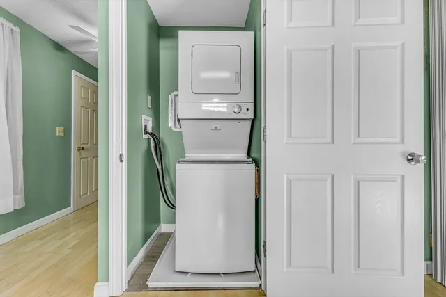a room with a washing machine and cabinets