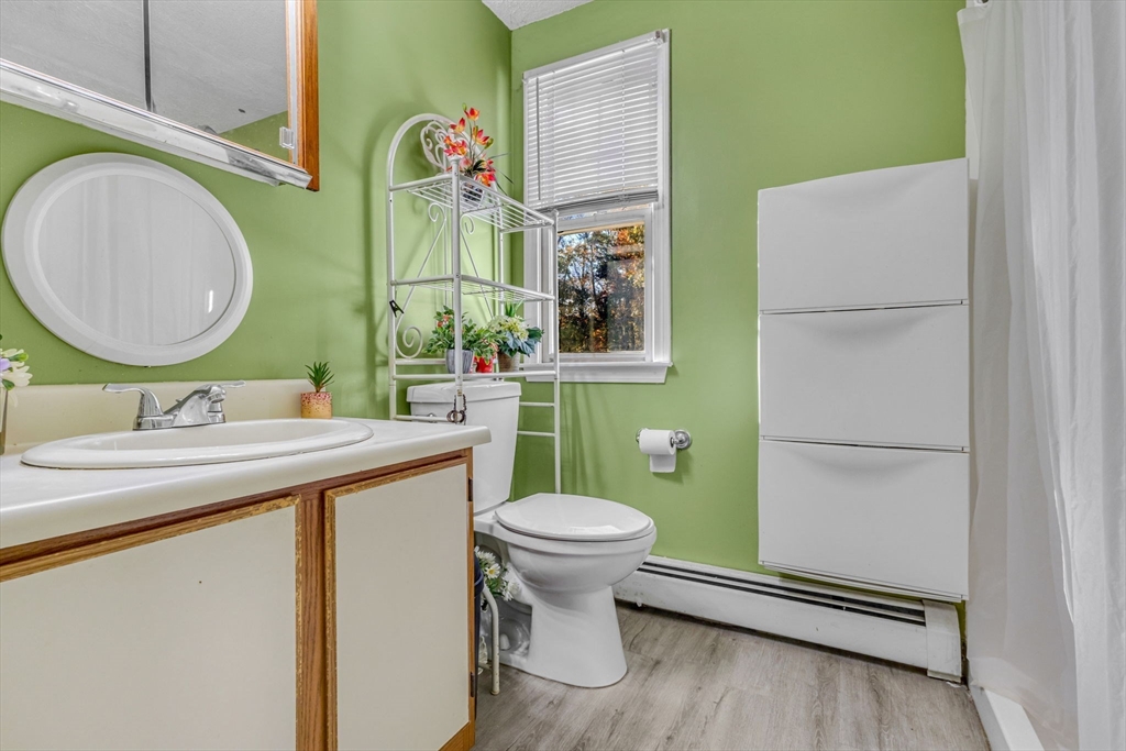 46 Vincent Circle Worcester, MA 01604 - Photo 14 of 27 a bathroom with a sink mirror vanity and toilet