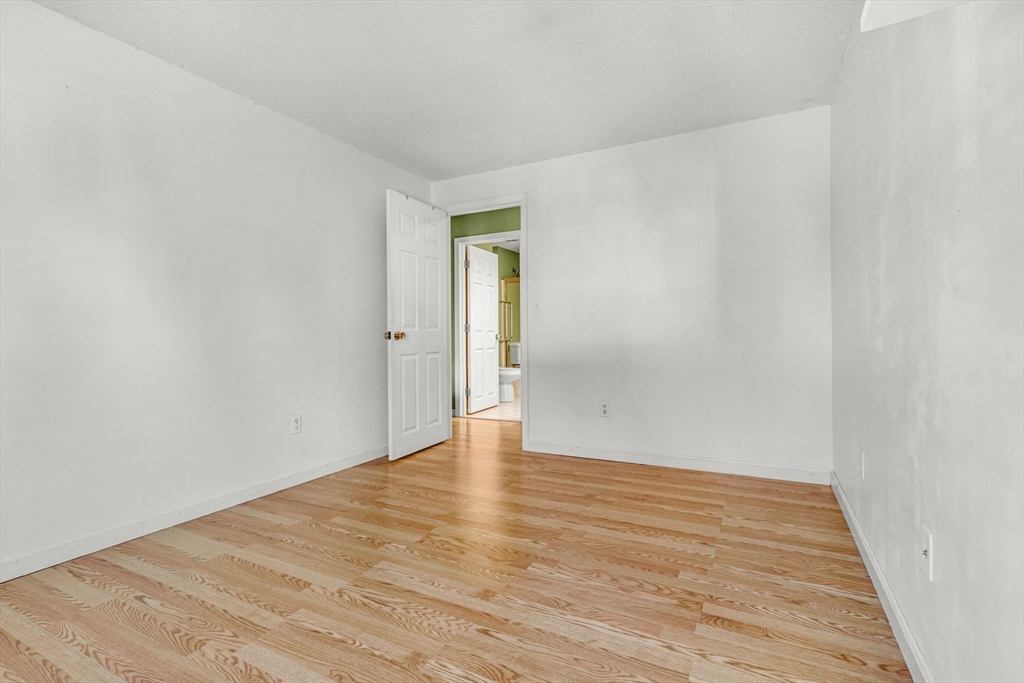 46 Vincent Circle Worcester, MA 01604 - Photo 21 of 27 a view of an empty room with wooden floor