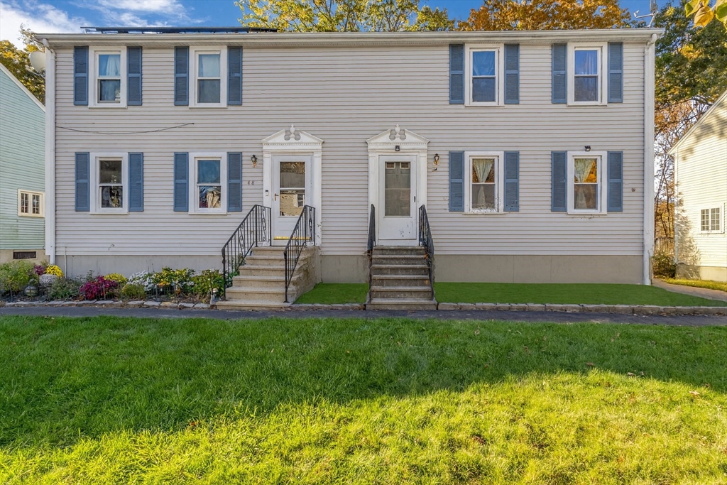 46 Vincent Circle Worcester, MA 01604 - Photo 27 of 27 a front view of a house with a yard and garage
