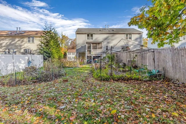 a view of a house with a yard and plants