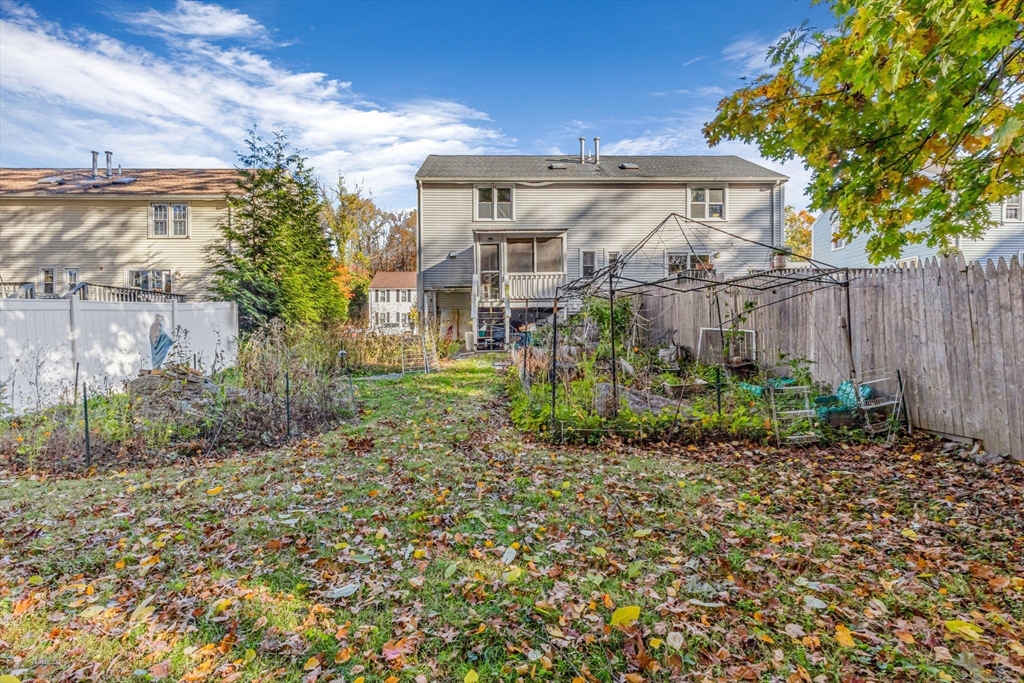 46 Vincent Circle Worcester, MA 01604 - Photo 3 of 27 a view of a house with a yard and plants