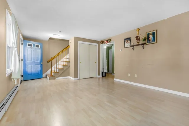 a view of an empty room with stairs