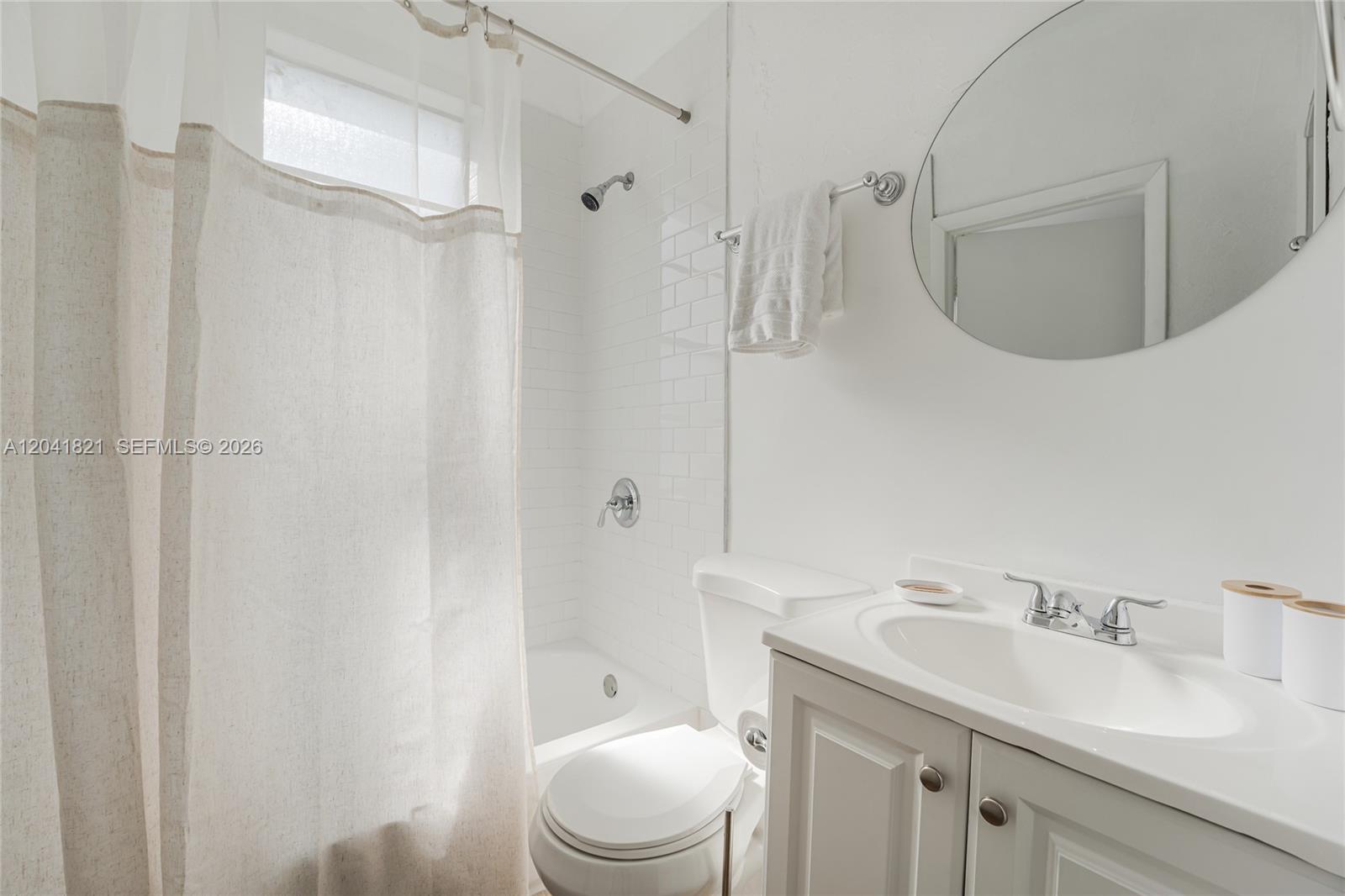 301 Southwest 10th Avenue, Unit 1 Miami, FL 33130 - Photo 5 of 6 a bathroom with a sink a toilet and shower