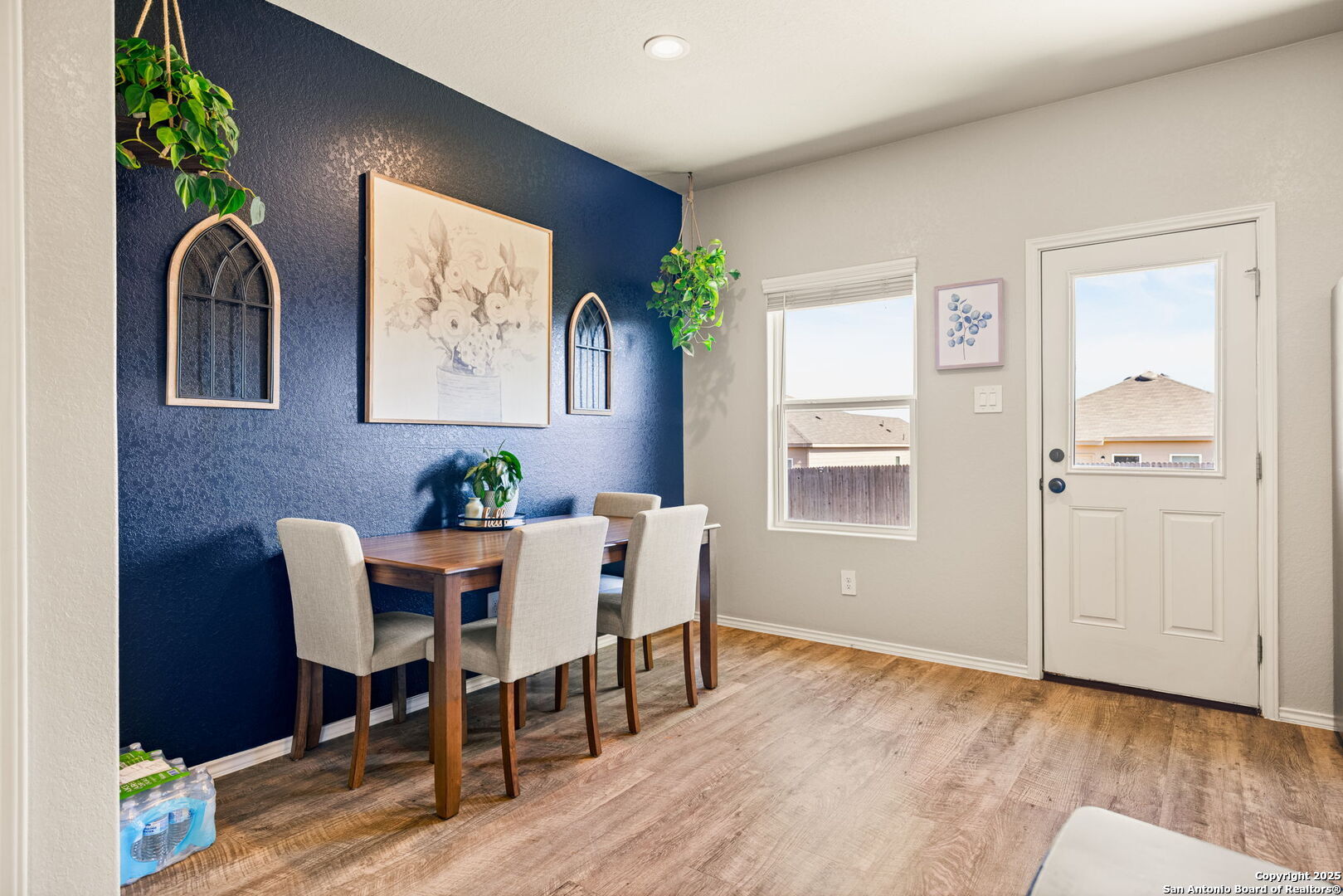 7311 Marina Del Rey Converse, TX 78109 - Photo 11 of 25 a view of a dining room with furniture window and wooden floor