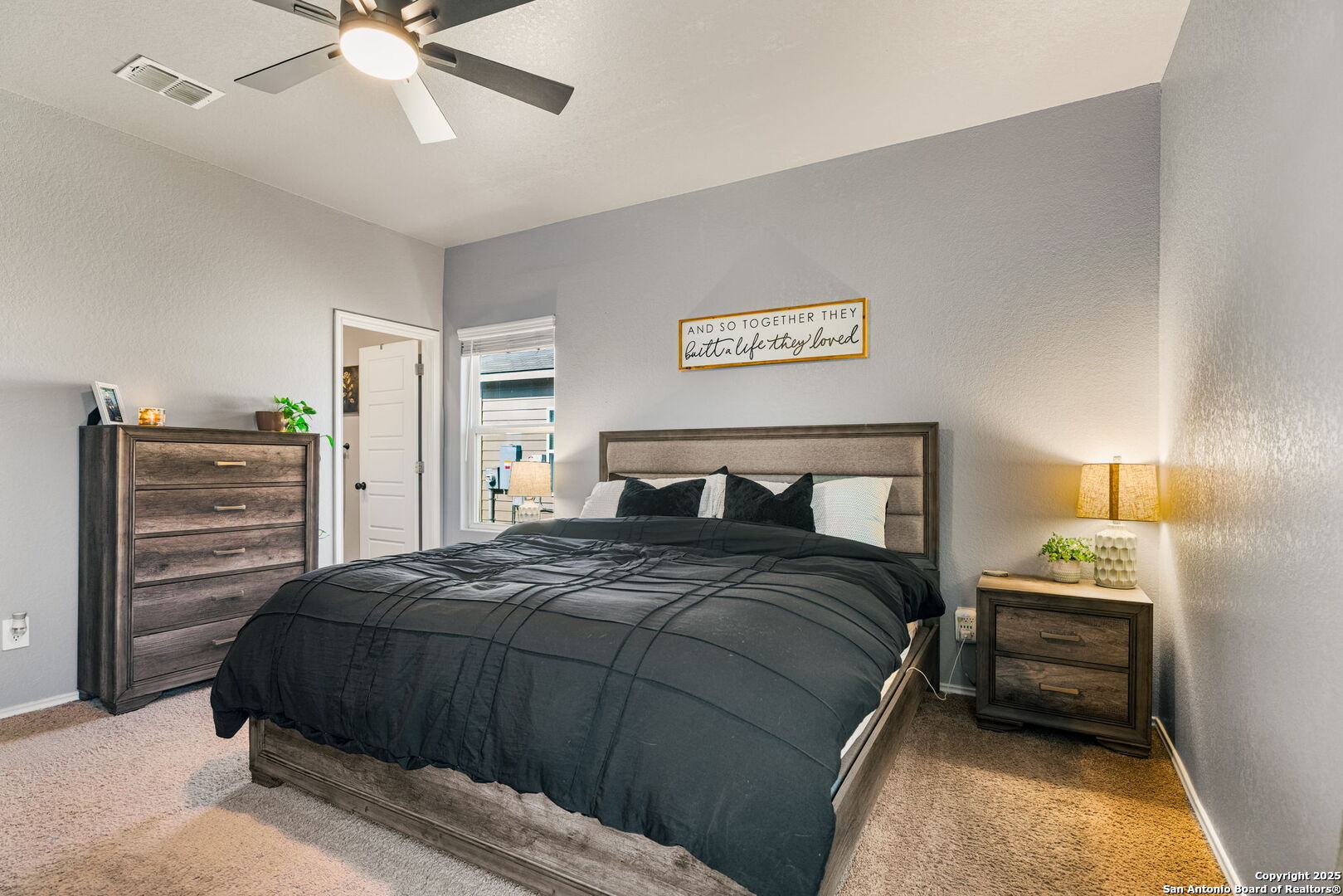 7311 Marina Del Rey Converse, TX 78109 - Photo 12 of 25 a bedroom with a bed and a chandelier