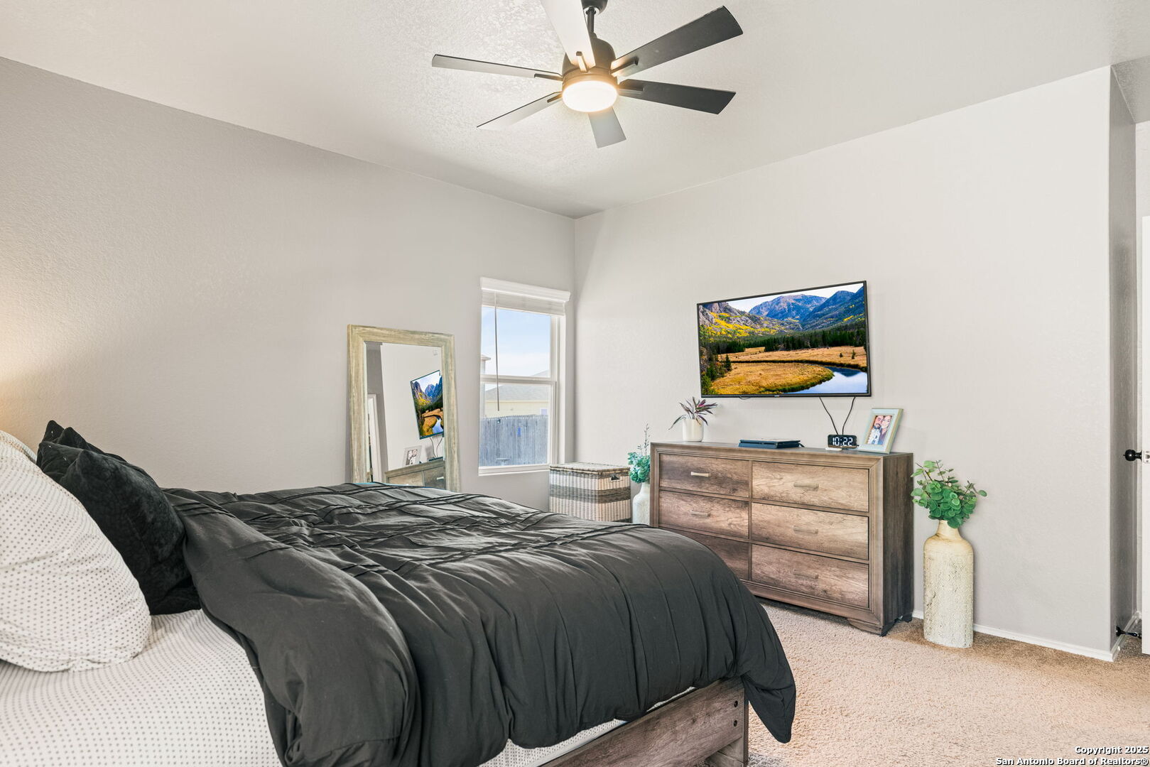 7311 Marina Del Rey Converse, TX 78109 - Photo 13 of 25 a bedroom with a bed and a flat screen tv