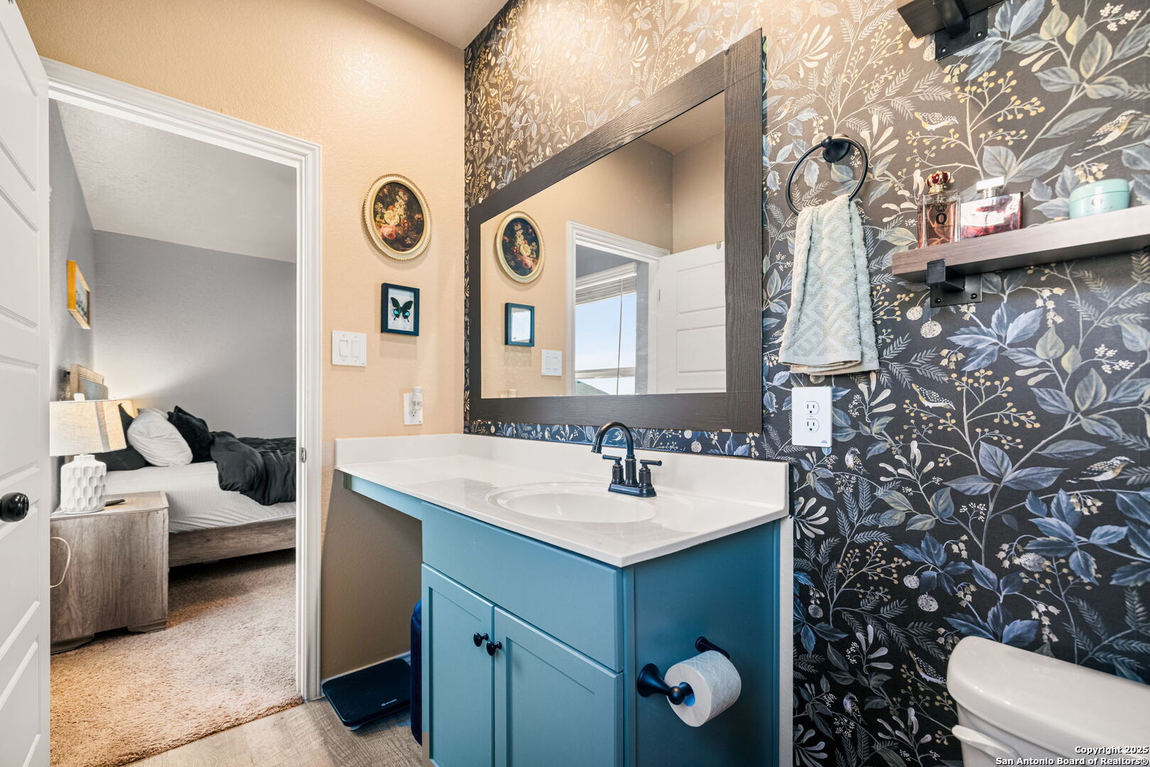 7311 Marina Del Rey Converse, TX 78109 - Photo 14 of 25 a bathroom with a sink and mirror with toilet