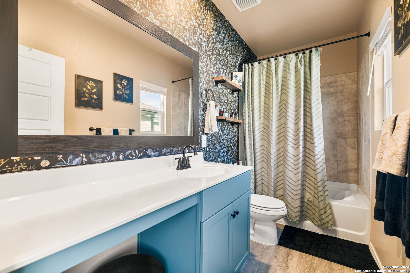 7311 Marina Del Rey Converse, TX 78109 - Photo 5 of 25 a bathroom with a sink a toilet and a mirror