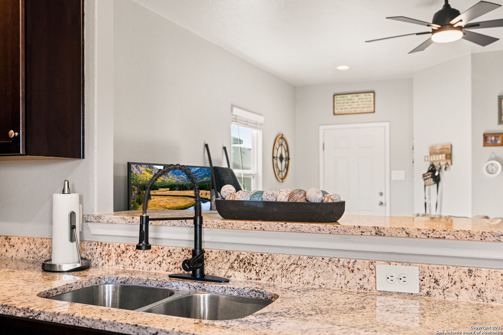 7311 Marina Del Rey Converse, TX 78109 - Photo 10 of 25 a kitchen with a faucet a sink and cabinets