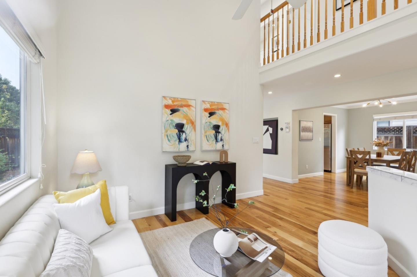 731 Calderon Avenue Mountain View, CA 94041 - Photo 13 of 55 a living room with furniture and wooden floor