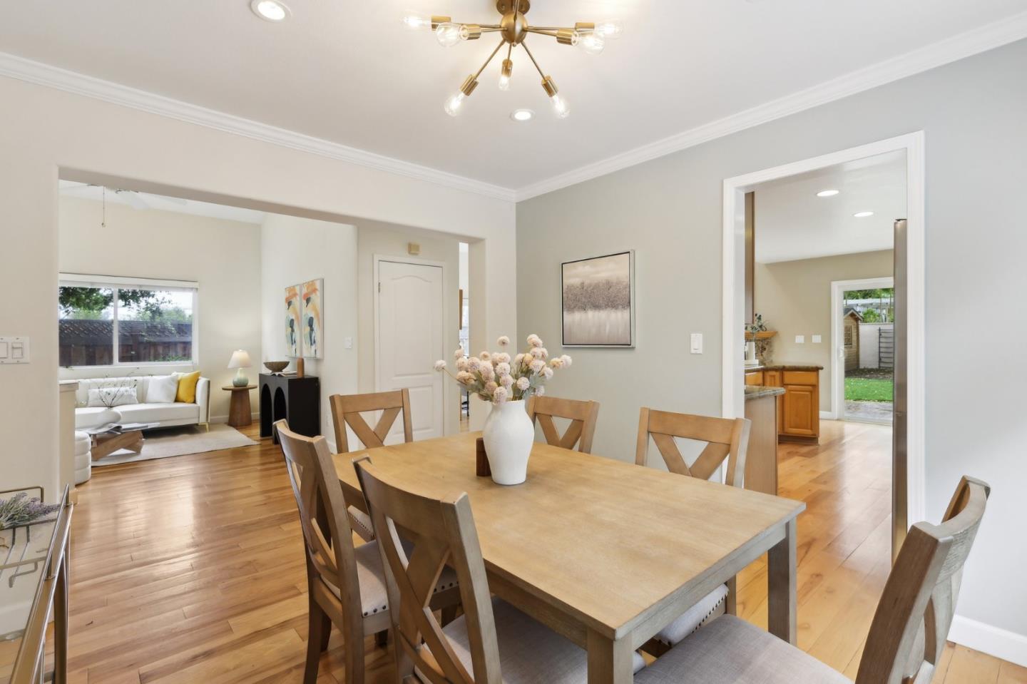 731 Calderon Avenue Mountain View, CA 94041 - Photo 19 of 55 a view of a dining room with furniture and wooden floor