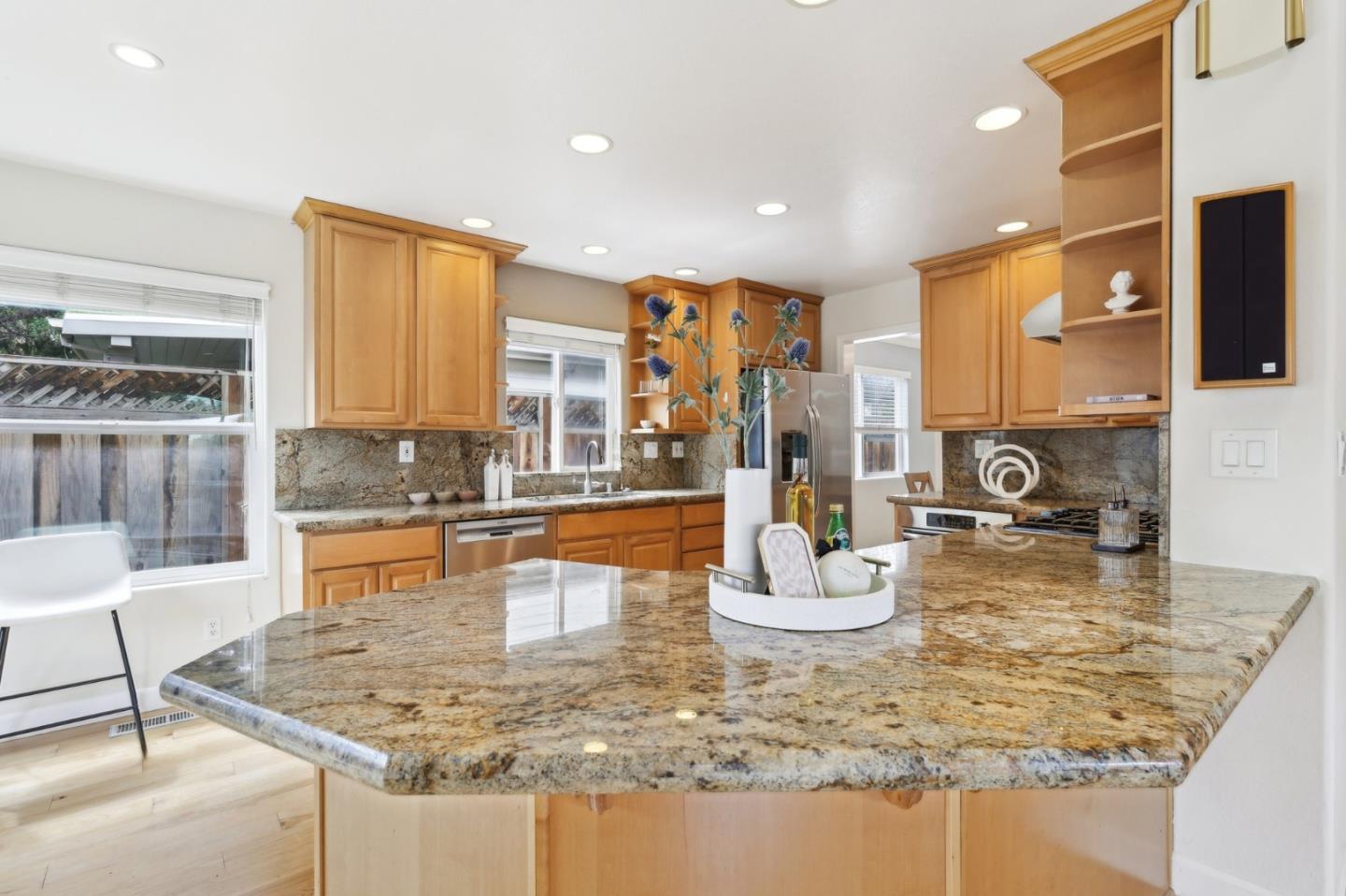 731 Calderon Avenue Mountain View, CA 94041 - Photo 20 of 55 a large kitchen with kitchen island granite countertop a large counter top and a stove
