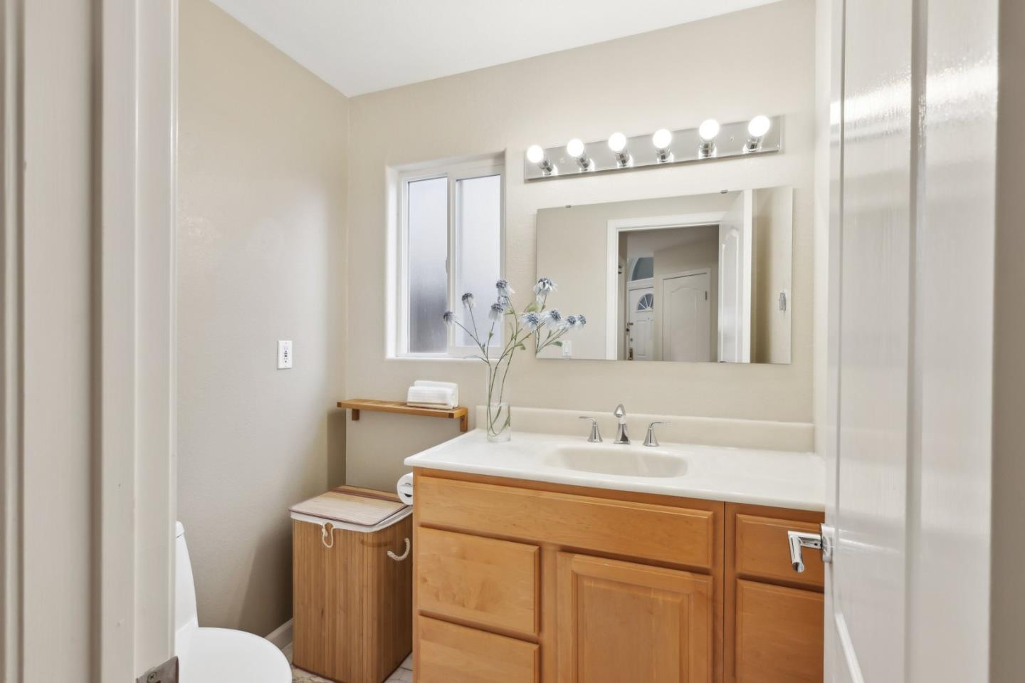 731 Calderon Avenue Mountain View, CA 94041 - Photo 26 of 55 a bathroom with a sink vanity and a mirror