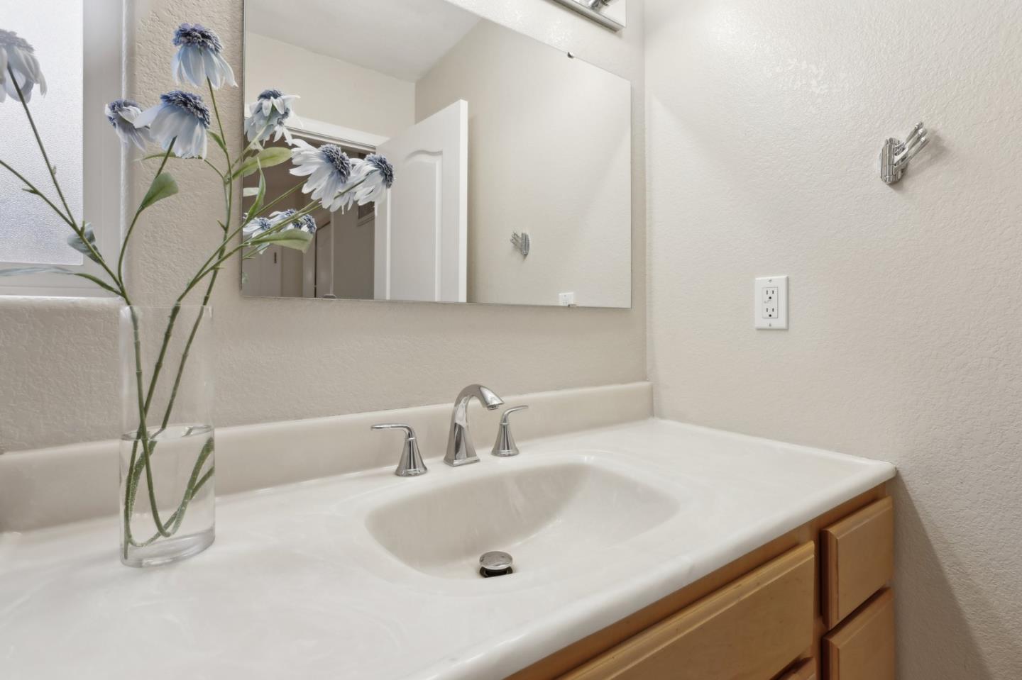 731 Calderon Avenue Mountain View, CA 94041 - Photo 27 of 55 a bathroom with a sink and a mirror