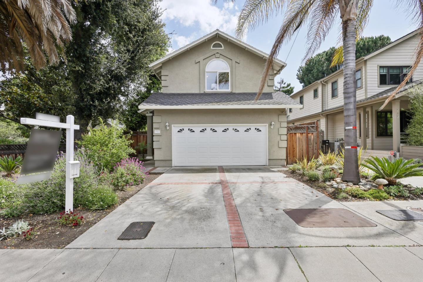 731 Calderon Avenue Mountain View, CA 94041 - Photo 3 of 55 a front view of a house with a yard and garage
