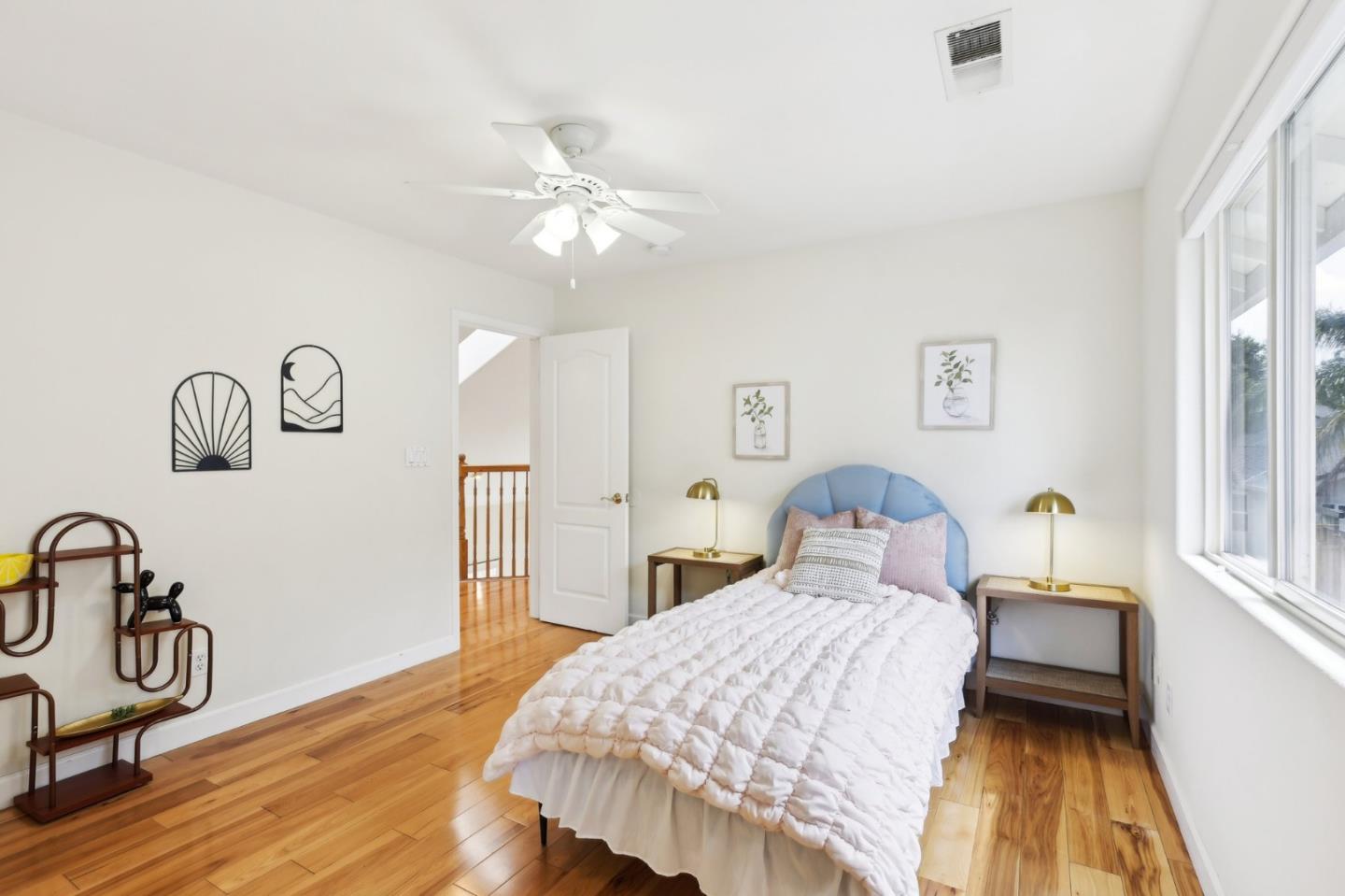 731 Calderon Avenue Mountain View, CA 94041 - Photo 32 of 55 a bedroom with a bed and wooden floor