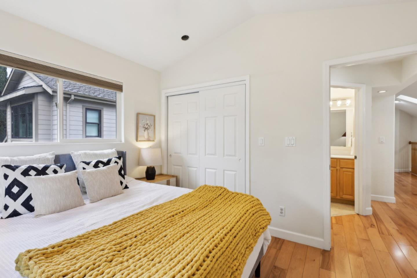 731 Calderon Avenue Mountain View, CA 94041 - Photo 34 of 55 a bedroom with a bed and wooden floor