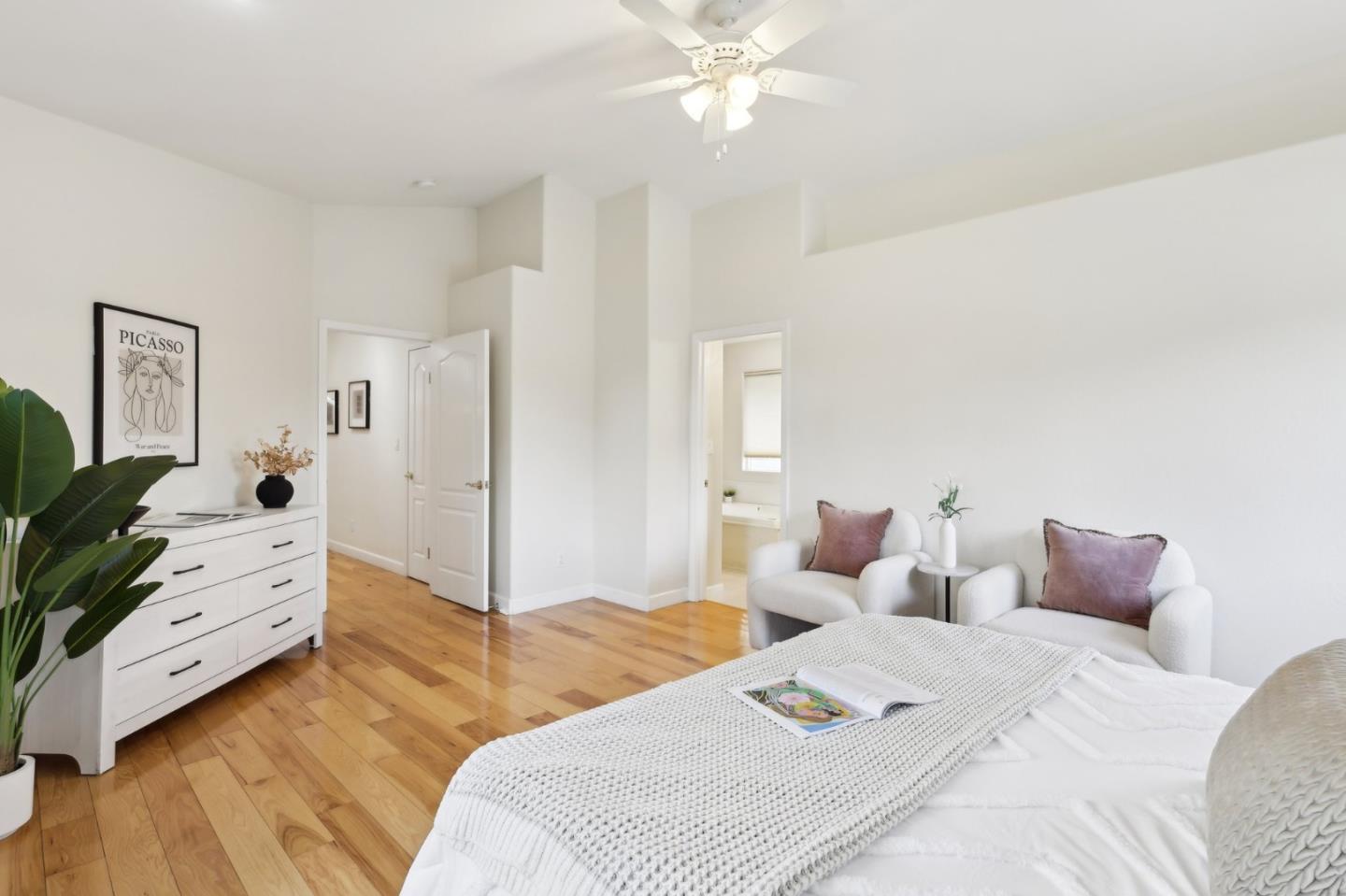 731 Calderon Avenue Mountain View, CA 94041 - Photo 37 of 55 a bedroom with a bed and a chandelier