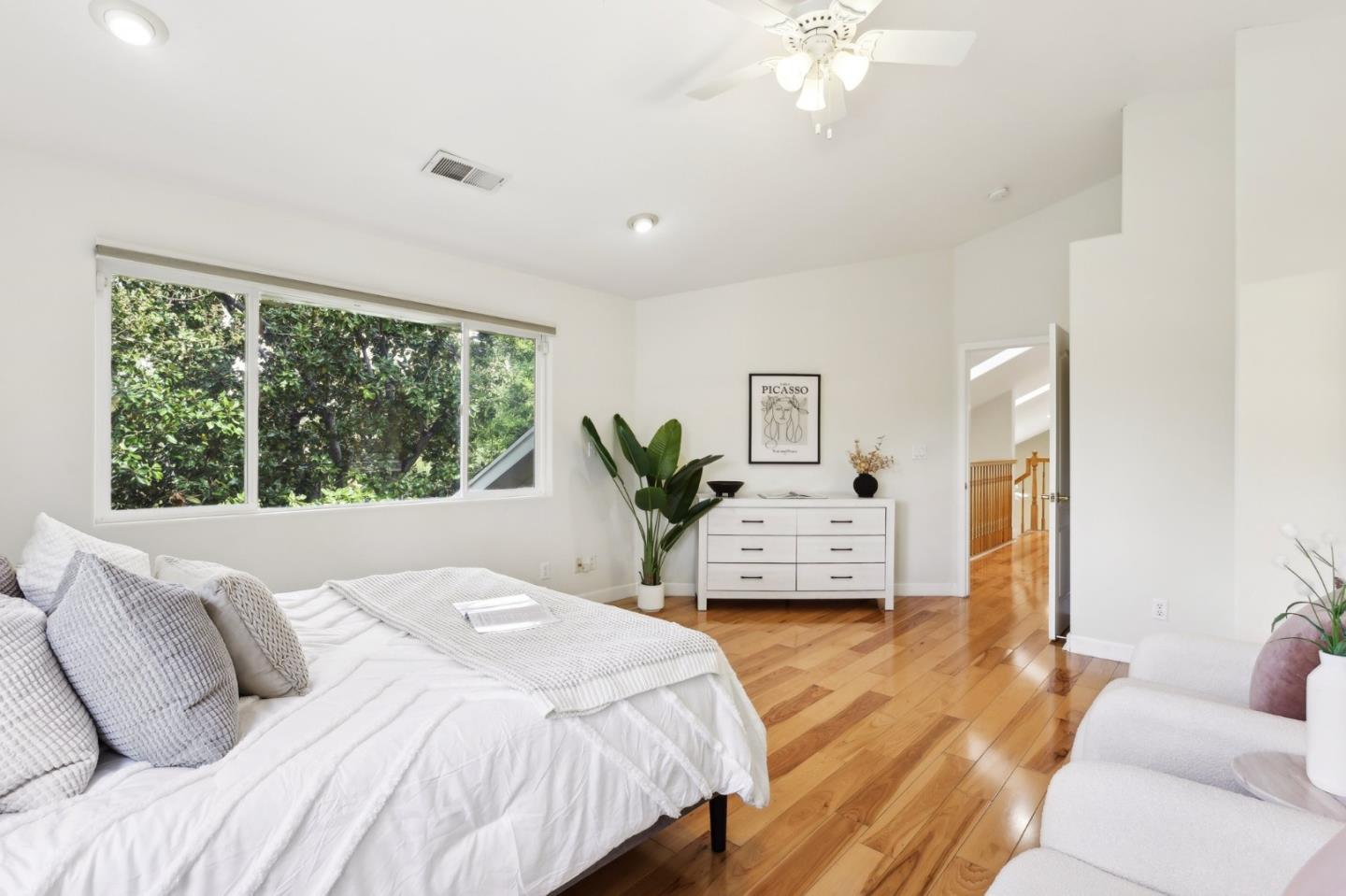 731 Calderon Avenue Mountain View, CA 94041 - Photo 38 of 55 a bedroom with a large bed and a chandelier