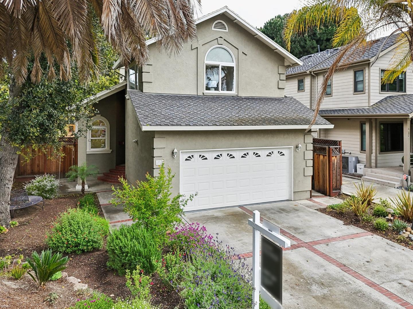 731 Calderon Avenue Mountain View, CA 94041 - Photo 8 of 55 a front view of a house with a garden and plants
