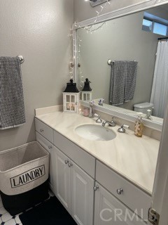 346 Hilltop Lane Brea, CA 92821 - Photo 21 of 26 a bathroom with a sink and a mirror
