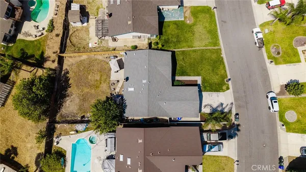 an aerial view of residential house with swimming pool
